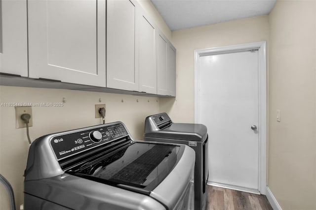 11664 NW 19th Dr, Coral Springs, FL 33071 - laundry room with cabinet space, washing machine and clothes dryer, and wood finished floors