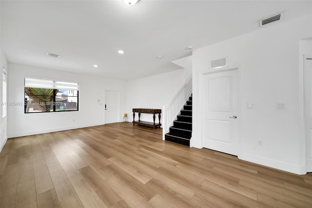 23061 SW 114th Path, Miami, FL 33170 - unfurnished living room featuring stairway, light wood-type flooring, and recessed lighting