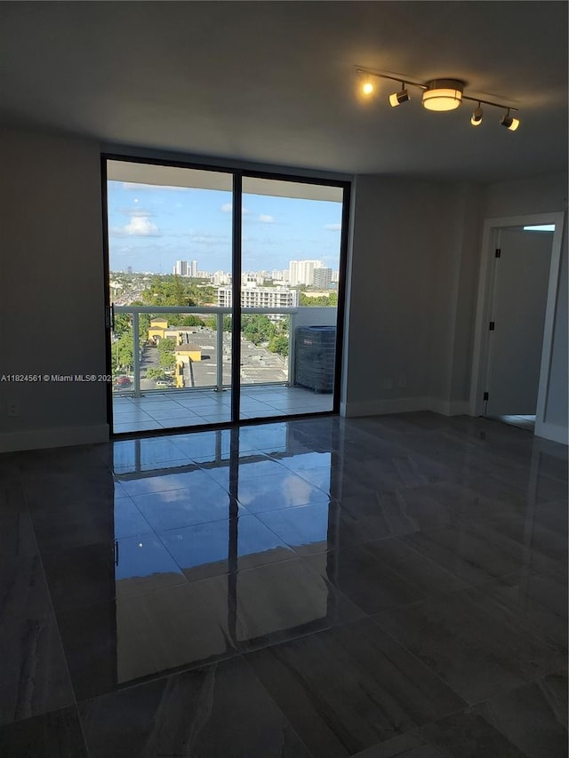 13499 Biscayne Blvd Unit 1105, North Miami, FL 33181 - tiled spare room featuring floor to ceiling windows and a city view