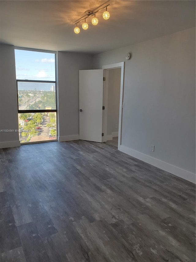 13499 Biscayne Blvd Unit 1105, North Miami, FL 33181 - unfurnished room featuring dark wood-style flooring and expansive windows