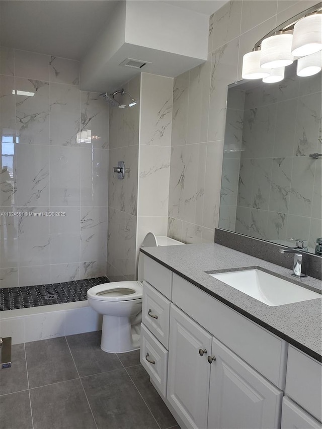 13499 Biscayne Blvd Unit 1105, North Miami, FL 33181 - full bath featuring vanity, a tile shower, tile walls, and tile patterned flooring