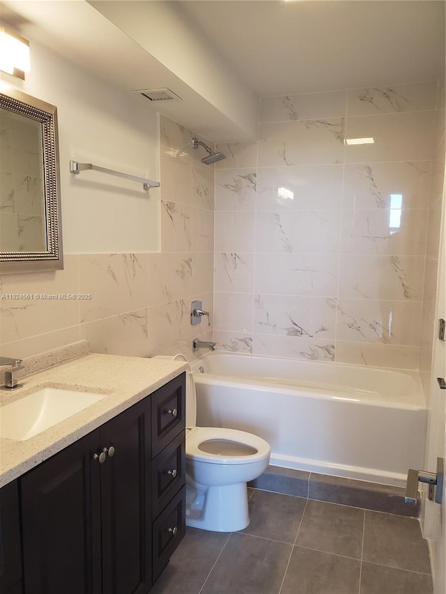 13499 Biscayne Blvd Unit 1105, North Miami, FL 33181 - full bath with vanity, shower / tub combination, tile patterned floors, and tile walls