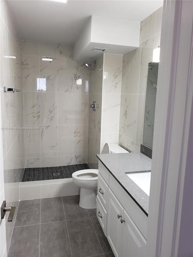 13499 Biscayne Blvd Unit 1105, North Miami, FL 33181 - bathroom with vanity, tiled shower, and tile patterned floors