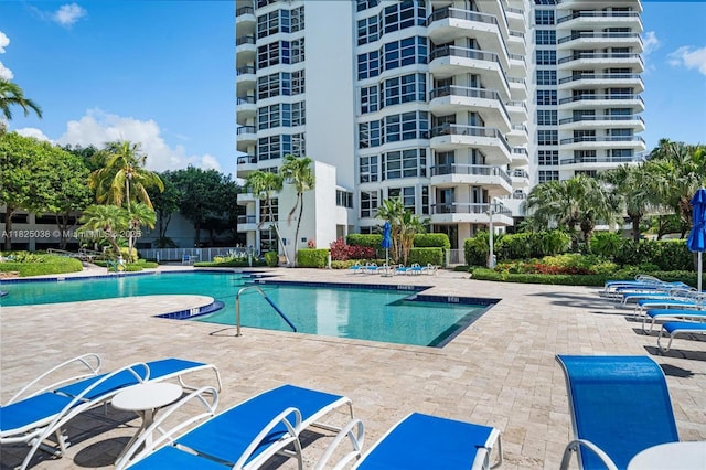 3500 Mystic Pointe Dr Unit 1702, Aventura, FL 33180 - community pool featuring a patio area