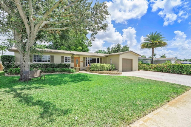 8220 NW 24th Ct, Pembroke Pines, FL 33024 - single story home with decorative driveway, an attached garage, stucco siding, and a front yard