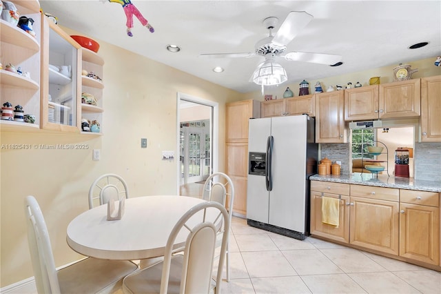 8220 NW 24th Ct, Pembroke Pines, FL 33024 - kitchen featuring stainless steel refrigerator with ice dispenser, a ceiling fan, light brown cabinets, decorative backsplash, and light tile patterned flooring