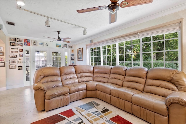 8220 NW 24th Ct, Pembroke Pines, FL 33024 - living room with a ceiling fan, light tile patterned floors, crown molding, rail lighting, and french doors