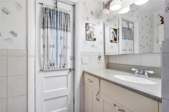 8220 NW 24th Ct, Pembroke Pines, FL 33024 - bathroom with tile walls, vanity, and wainscoting