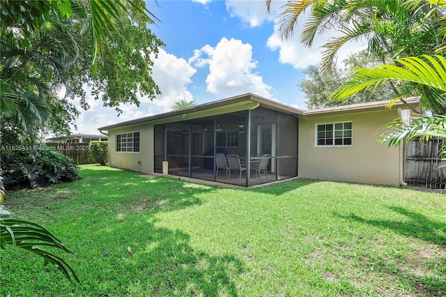 8220 NW 24th Ct, Pembroke Pines, FL 33024 - rear view of property featuring a sunroom, stucco siding, and a fenced backyard