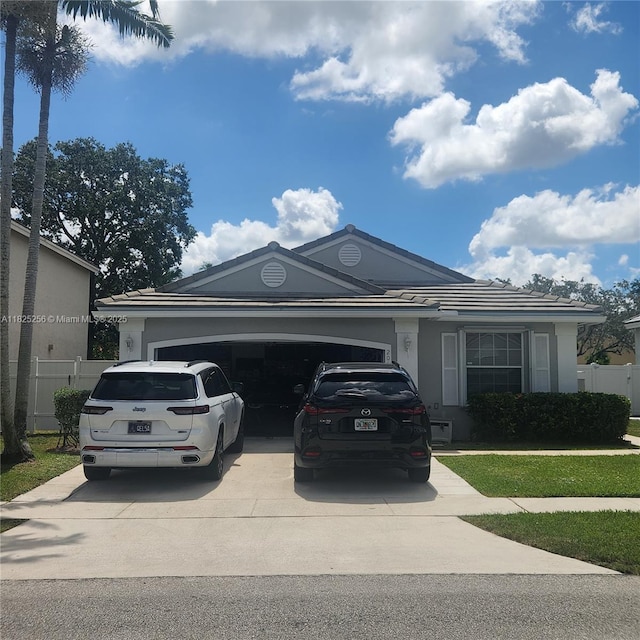 2017 NW 182nd Ave, Pembroke Pines, FL 33029 - view of front facade featuring driveway, an attached garage, stucco siding, and a tiled roof