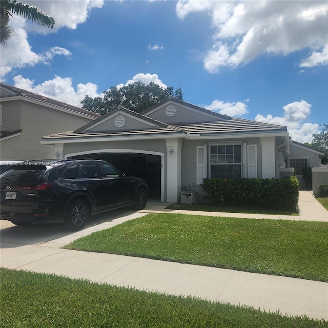 2017 NW 182nd Ave, Pembroke Pines, FL 33029 - ranch-style house with an attached garage, a front yard, stucco siding, and concrete driveway