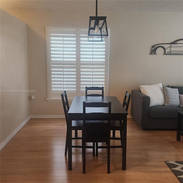 2017 NW 182nd Ave, Pembroke Pines, FL 33029 - dining area with light wood-type flooring and a textured ceiling