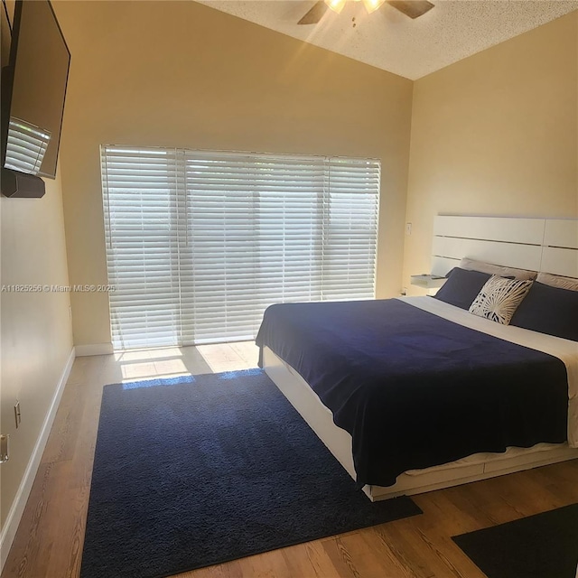 2017 NW 182nd Ave, Pembroke Pines, FL 33029 - bedroom with wood finished floors, a ceiling fan, lofted ceiling, and a textured ceiling