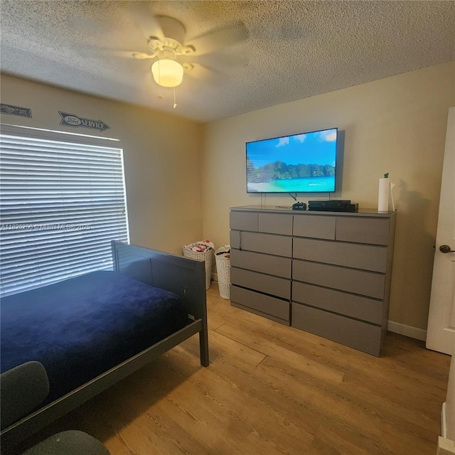 2017 NW 182nd Ave, Pembroke Pines, FL 33029 - bedroom with light wood-type flooring, a textured ceiling, and a ceiling fan