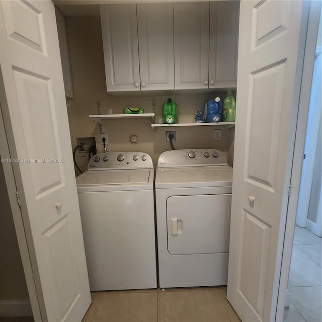 2017 NW 182nd Ave, Pembroke Pines, FL 33029 - laundry area featuring washing machine and dryer, light tile patterned flooring, and cabinet space