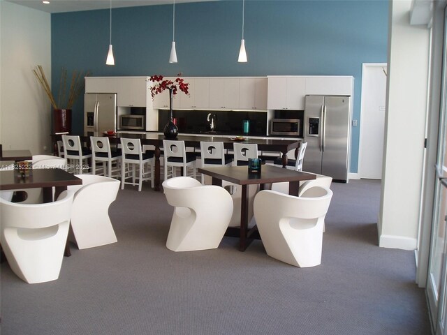 18800 NE 29th Ave Unit 730, Aventura, FL 33180 - dining space with a high ceiling and carpet flooring