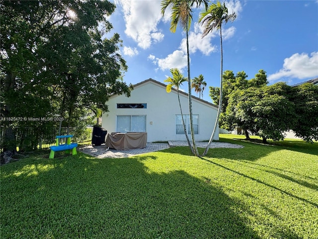 2091 SW 157th Ave, Miramar, FL 33027 - rear view of property featuring stucco siding and a yard