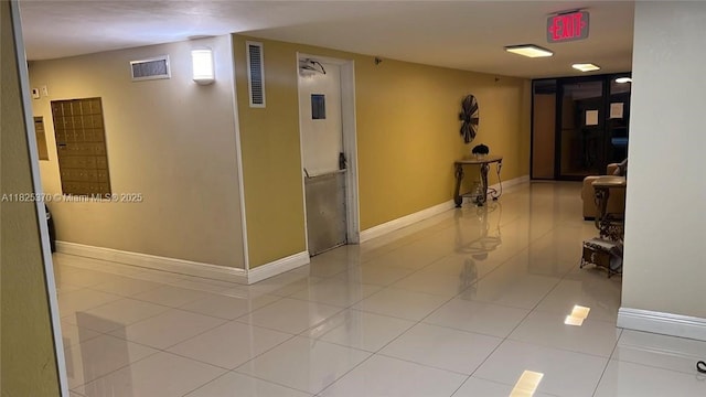17878 N Bay Rd Unit 507, Sunny Isles Beach, FL 33160 - corridor with tile patterned floors and baseboards