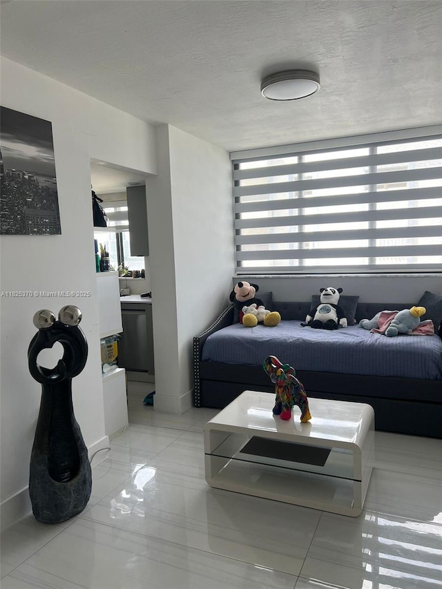 17878 N Bay Rd Unit 507, Sunny Isles Beach, FL 33160 - living room featuring baseboards and light tile patterned floors