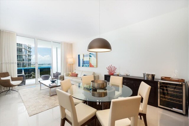 15811 Collins Ave Unit 1502, Sunny Isles Beach, FL 33160 - tiled dining space with wine cooler and floor to ceiling windows