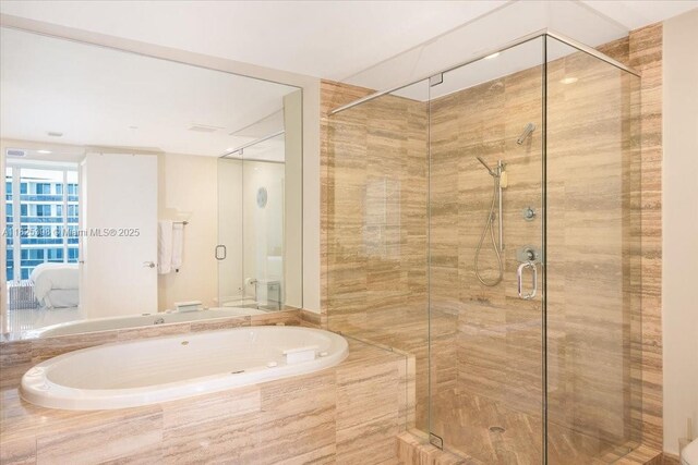 15811 Collins Ave Unit 1502, Sunny Isles Beach, FL 33160 - bathroom featuring a bath, a shower stall, and ensuite bathroom