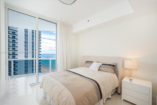 15811 Collins Ave Unit 1502, Sunny Isles Beach, FL 33160 - bedroom featuring a water view, access to exterior, and expansive windows