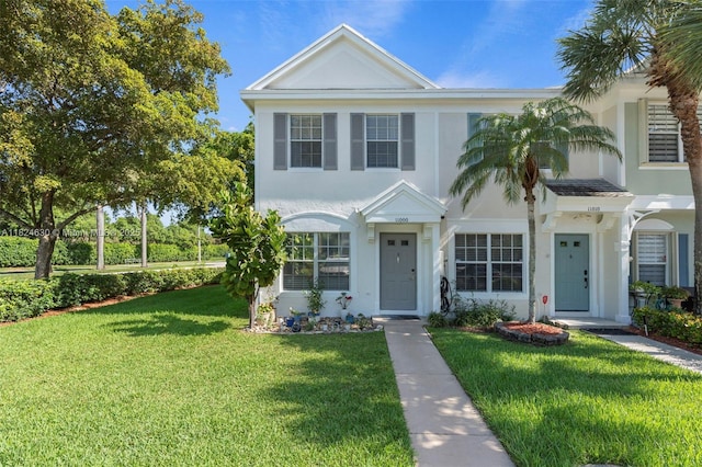 11000 Sand Piper Ct, Tamarac, FL 33321 - view of front of house featuring a front yard and stucco siding