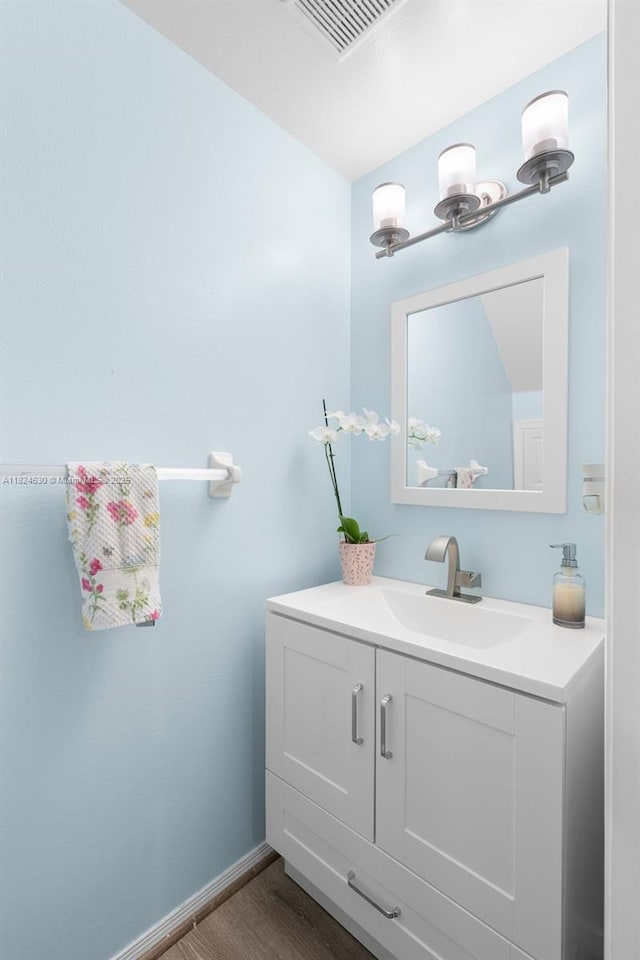 11000 Sand Piper Ct, Tamarac, FL 33321 - bathroom with wood finished floors and vanity