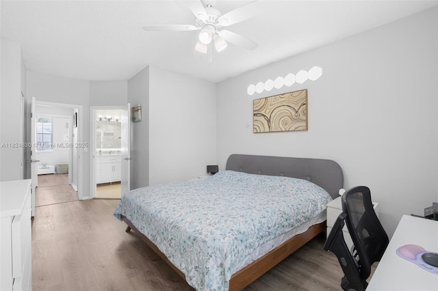 11000 Sand Piper Ct, Tamarac, FL 33321 - bedroom with wood finished floors, ceiling fan, and ensuite bath