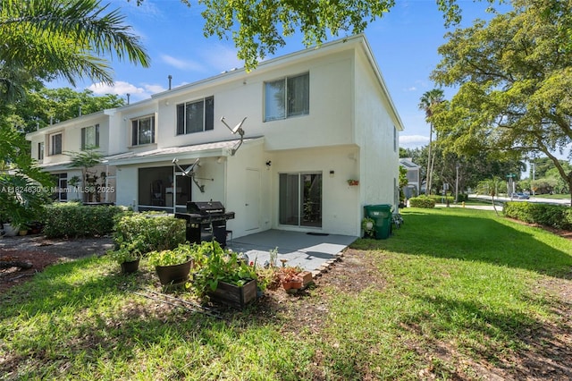 11000 Sand Piper Ct, Tamarac, FL 33321 - back of house featuring stucco siding, a lawn, and a patio