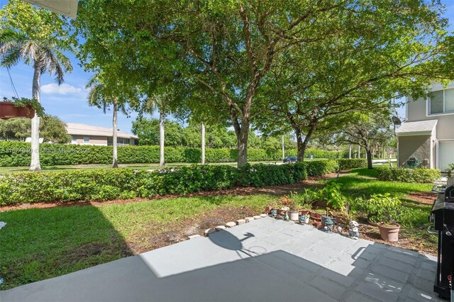 11000 Sand Piper Ct, Tamarac, FL 33321 - view of yard featuring a patio