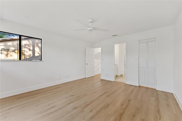 7720 NW 79th Ave Unit B6, Tamarac, FL 33321 - unfurnished bedroom featuring light wood finished floors, connected bathroom, and ceiling fan