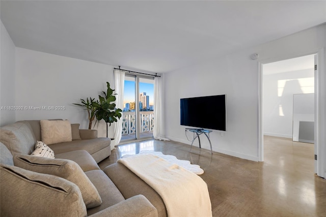 1020 Meridian Ave Unit 816, Miami Beach, FL 33139 - living room with baseboards and concrete floors