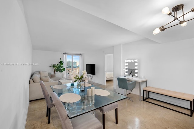 1020 Meridian Ave Unit 816, Miami Beach, FL 33139 - dining area featuring finished concrete flooring and a chandelier