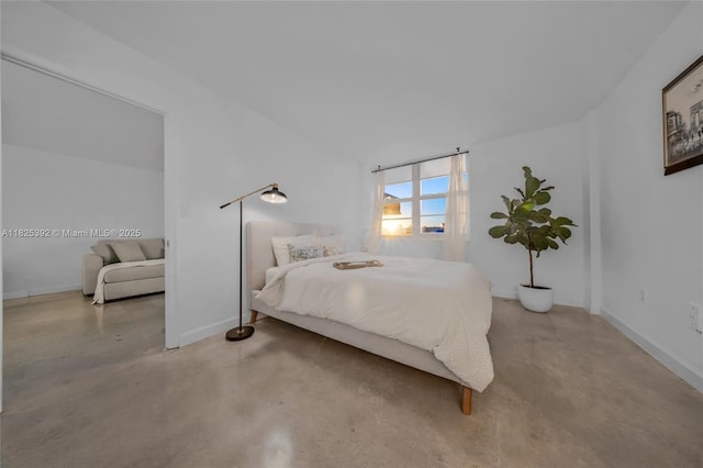 1020 Meridian Ave Unit 816, Miami Beach, FL 33139 - bedroom featuring concrete floors and baseboards