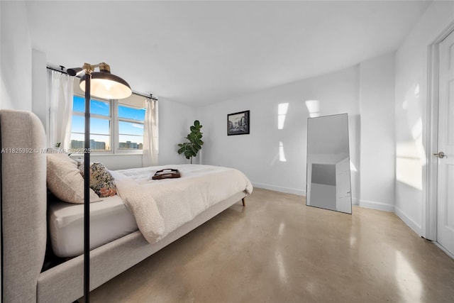 1020 Meridian Ave Unit 816, Miami Beach, FL 33139 - bedroom with concrete flooring and baseboards
