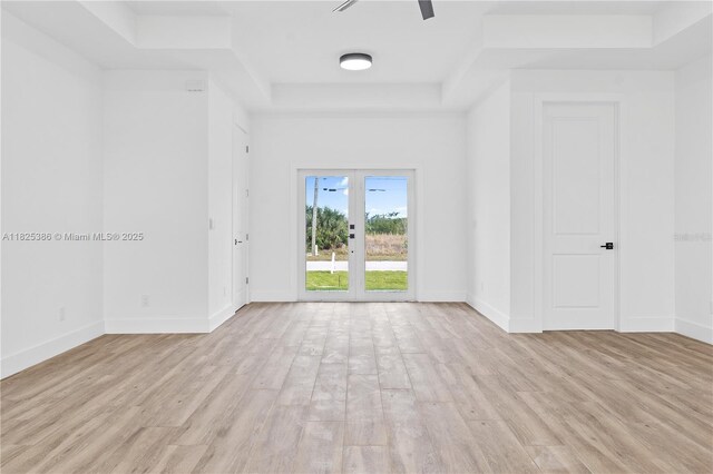 10071 Kingsville Prt, Charlotte, FL 33981 - spare room with a raised ceiling and light wood finished floors