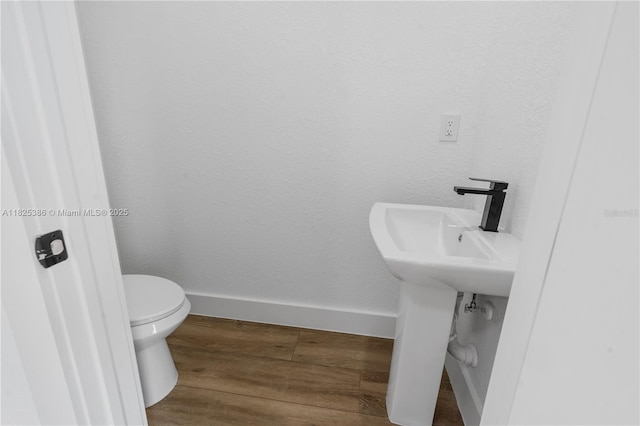 10071 Kingsville Prt, Charlotte, FL 33981 - bathroom with wood finished floors and toilet
