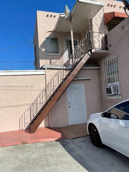 829 SW 19th Ave, Miami, FL 33135 - view of building exterior with cooling unit and stairs