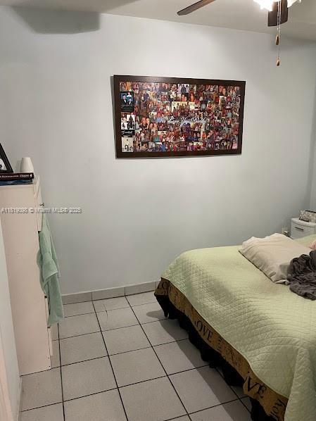 829 SW 19th Ave, Miami, FL 33135 - bedroom featuring light tile patterned floors and a ceiling fan