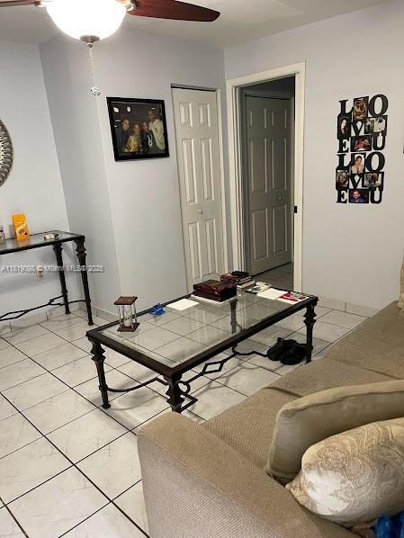 829 SW 19th Ave, Miami, FL 33135 - living area with light tile patterned floors and a ceiling fan
