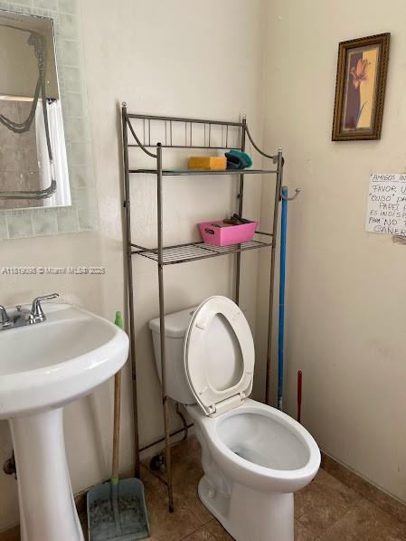 829 SW 19th Ave, Miami, FL 33135 - bathroom with toilet and tile patterned floors