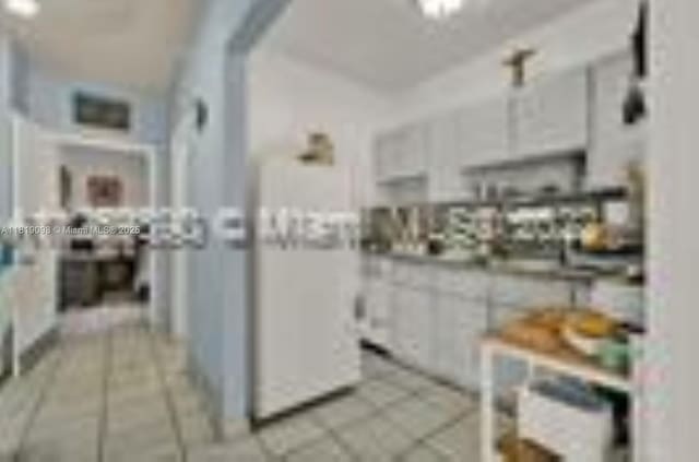 829 SW 19th Ave, Miami, FL 33135 - kitchen with light tile patterned flooring