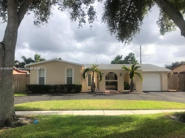 9200 SW 54th St, Cooper City, FL 33328 - view of front of property with driveway, stucco siding, and an attached garage
