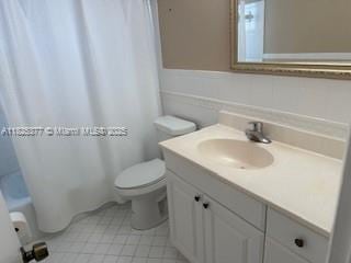 9200 SW 54th St, Cooper City, FL 33328 - bathroom with vanity, shower / bathtub combination with curtain, and tile patterned floors