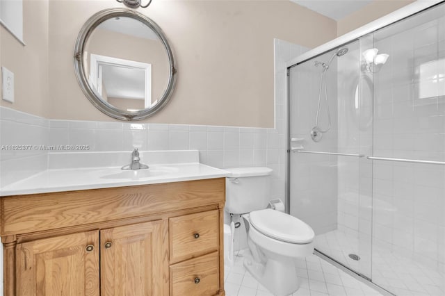 9200 SW 54th St, Cooper City, FL 33328 - full bath with tile walls, vanity, a shower stall, wainscoting, and tile patterned flooring