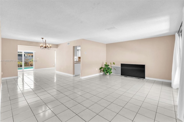 9200 SW 54th St, Cooper City, FL 33328 - empty room featuring a chandelier, a textured ceiling, and light tile patterned floors