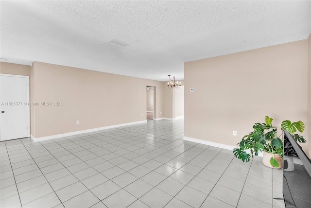 9200 SW 54th St, Cooper City, FL 33328 - spare room with a chandelier, light tile patterned flooring, and a textured ceiling