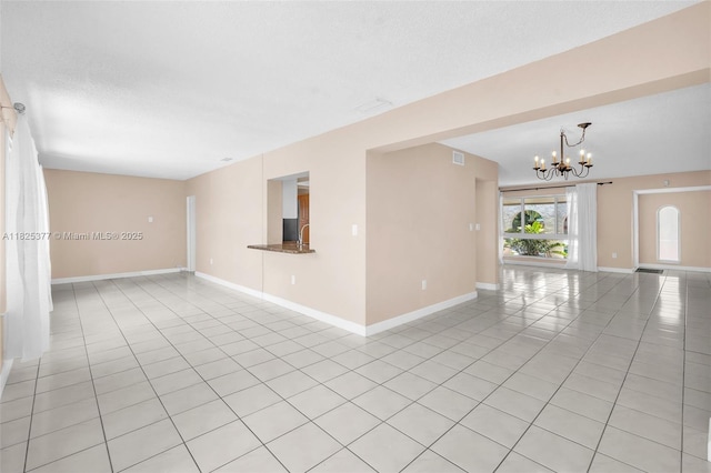 9200 SW 54th St, Cooper City, FL 33328 - spare room featuring light tile patterned floors and a chandelier