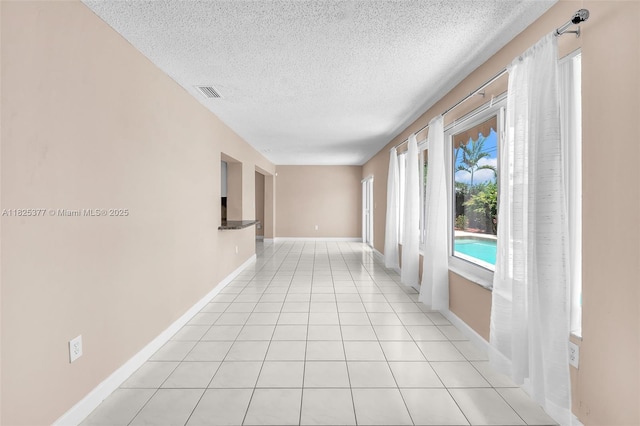 9200 SW 54th St, Cooper City, FL 33328 - hallway featuring a textured ceiling and light tile patterned flooring
